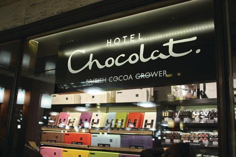 The gently curving fascia of the Hotel Chocolat pop-up is as long as the well-lit perimeter wall inside the shop, allowing the whole of the offer to be viewed at a glance.